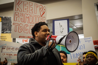 Herve Comeau, a graduate student in the M.F.A. program and a member of Black Lives Matter in Syracuse, said he wanted to stand with the movement supporting undocumented immigrants and immigrants from majority Muslim countries.